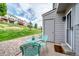 Patio area with a table and chairs, overlooking a grassy hill at 9467 W Ontario Dr, Littleton, CO 80128