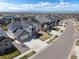 Aerial view of a neighborhood featuring homes with well-manicured lawns and convenient street access at 228 Horizon Ave, Erie, CO 80516