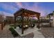 Backyard featuring a pergola with string lights, seating area with fire pit, and a trampoline at 228 Horizon Ave, Erie, CO 80516