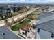 Overhead view of backyard with a pergola-covered patio, fire pit, and surrounding fenced yard at 228 Horizon Ave, Erie, CO 80516