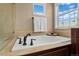 Close up on a soaking tub with chrome fixtures at 228 Horizon Ave, Erie, CO 80516