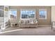 Comfortable bonus room with a sofa and lots of natural light at 228 Horizon Ave, Erie, CO 80516