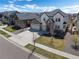 Elegant two-story home with a three-car garage and meticulously landscaped front yard in a suburban neighborhood at 228 Horizon Ave, Erie, CO 80516