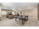 Open finished basement with ping pong, a sectional couch, and a TV for ultimate relaxation at 228 Horizon Ave, Erie, CO 80516