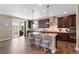 Modern kitchen with a large island, stainless steel appliances, and a sliding door to the patio at 228 Horizon Ave, Erie, CO 80516
