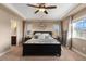 Inviting main bedroom featuring elegant tray ceilings, and windows with plenty of natural light at 228 Horizon Ave, Erie, CO 80516