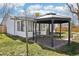 Cozy backyard featuring gazebo, patio, and well-maintained lawn at 2633 Mather St, Brighton, CO 80601