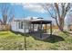 Cozy backyard featuring gazebo, patio, and well-maintained lawn at 2633 Mather St, Brighton, CO 80601