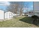Large backyard with storage shed, garden space, gazebo and a well-maintained lawn at 2633 Mather St, Brighton, CO 80601