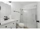 Modern bathroom with a glass-enclosed shower, sleek vanity, and contemporary fixtures at 2633 Mather St, Brighton, CO 80601