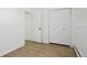 Bedroom features light wood flooring, closet space, and a neutral color palette at 2633 Mather St, Brighton, CO 80601
