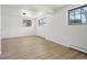 Bright, neutral bedroom features light wood floors and ample natural light at 2633 Mather St, Brighton, CO 80601