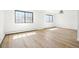 Light-filled bedroom with wood-look floors, offering a peaceful and spacious retreat at 2633 Mather St, Brighton, CO 80601