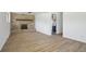 Spacious living room features a brick fireplace and modern light wood flooring at 2633 Mather St, Brighton, CO 80601