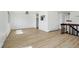 Bright living room with natural light and wood-look floors, perfect for entertaining at 2633 Mather St, Brighton, CO 80601