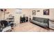Comfortable basement area featuring stylish decor and light wood flooring, perfect for relaxation and entertainment at 8633 E Monmouth Pl, Denver, CO 80237