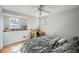 Bedroom with neutral paint and a desk by the window, offering natural light at 8633 E Monmouth Pl, Denver, CO 80237
