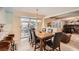 Dining area with sliding doors to a patio, seamlessly connecting indoor and outdoor living spaces at 8633 E Monmouth Pl, Denver, CO 80237