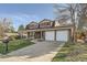 Charming two-story home with a well-manicured lawn and inviting curb appeal at 8633 E Monmouth Pl, Denver, CO 80237