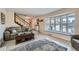 Bright and airy living room with a large bay window, perfect for relaxing and entertaining at 8633 E Monmouth Pl, Denver, CO 80237