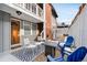 Inviting outdoor patio with a fire pit, seating area, and a charming entrance to the home at 160 Jackson St # 5, Denver, CO 80206