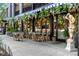 Outdoor seating area at a restaurant with hanging flowers, creating a charming dining atmosphere at 160 Jackson St # 5, Denver, CO 80206