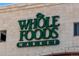 A clear and bright storefront of a Whole Foods Market at 160 Jackson St # 5, Denver, CO 80206