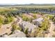 Aerial view of the neighborhood showcasing the buildings, landscaping, and surrounding area with mountains at 8378 S Upham Way # A102, Littleton, CO 80128