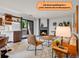 Cozy living room features a fireplace, comfortable seating, and natural light, creating an inviting space at 8378 S Upham Way # A102, Littleton, CO 80128