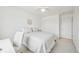 Bright bedroom featuring an all-white palette and a ceiling fan for enhanced comfort at 5465 Tall Spruce St, Brighton, CO 80601