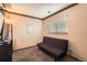 Simple bedroom with a futon, neutral walls, and a window at 21367 E Aberdeen Dr, Centennial, CO 80015