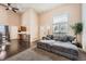 Bright living room with a soaring ceiling, large window, hardwood floors, and plush seating at 21367 E Aberdeen Dr, Centennial, CO 80015