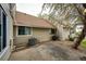 Townhouse backyard featuring a patio with privacy fence, mature trees and lush garden views at 2459 S Xanadu Way # B, Aurora, CO 80014