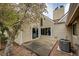 Townhouse patio features a cozy outdoor space, sliding door access, and serene garden views at 2459 S Xanadu Way # B, Aurora, CO 80014