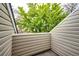 Balcony offering a view of a lush green tree, surrounded by siding at 2459 S Xanadu Way # B, Aurora, CO 80014