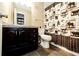 Bathroom features a vanity, toilet, and themed shower curtain with a wildlife motif at 2459 S Xanadu Way # B, Aurora, CO 80014