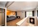 Bedroom offers wood wall accent, neutral carpeting, and sliding doors to outside balcony at 2459 S Xanadu Way # B, Aurora, CO 80014