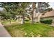 Well-maintained lawn and landscaping in a residential neighborhood with mature trees at 2459 S Xanadu Way # B, Aurora, CO 80014