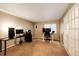Versatile room with desks and plenty of space, ideal for a home office or a study area at 2459 S Xanadu Way # B, Aurora, CO 80014