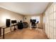 Versatile room with desks and plenty of space, ideal for a home office or a study area at 2459 S Xanadu Way # B, Aurora, CO 80014