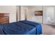 This primary bedroom features plush carpeting, a flat-screen TV, and access to a private balcony at 1456 Sepia Ave, Longmont, CO 80501