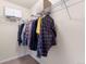 Walk-in closet featuring ample storage space with hanging rods and shelving at 1456 Sepia Ave, Longmont, CO 80501