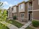Charming townhome featuring a well-maintained lawn and a welcoming facade at 1456 Sepia Ave, Longmont, CO 80501