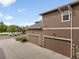 A spacious two-car garage with tan siding and stone accents at 1456 Sepia Ave, Longmont, CO 80501