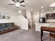 Open concept living space blending kitchen and living areas with a staircase at 1456 Sepia Ave, Longmont, CO 80501