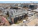 An aerial view of a modern multi-Gathering unit showcases its rooftop design and surrounding downtown neighborhood at 350 Detroit St # 107, Denver, CO 80206