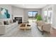 Staged living room features a fireplace, balcony, and modern decor at 350 Detroit St # 107, Denver, CO 80206