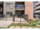 Private patio with black metal fence on an apartment, great for outdoor relaxing and entertaining at 350 Detroit St # 107, Denver, CO 80206