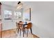Cozy dining area featuring a modern chandelier and a table for four at 4201 Shoshone St, Denver, CO 80211