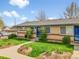 Charming single-story home with brick accents, blue shutters, and a well-maintained lawn at 4201 Shoshone St, Denver, CO 80211